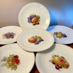 Set of six vintage Victoria Germany salad or luncheon plates with various fruit images and gold rim