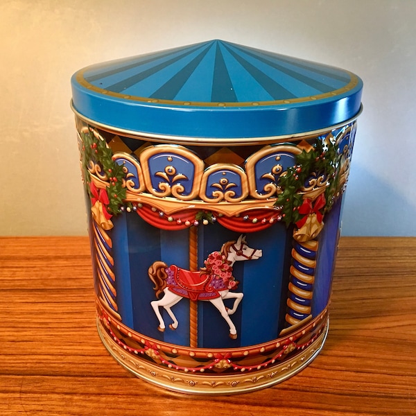 Vintage Harry London blue embossed Christmas carousel tin - 6.5" tall and 5.75" in diameter