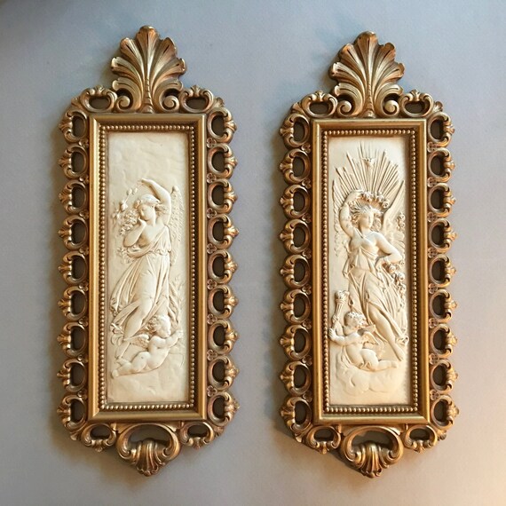 Pair Of Elegant 1976 Wall Decor Plaques Featuring Angels And Cherubs In Gold Frames By Dart - Angel Wall Decor Plaques Pair Of Elegant 1976 Wall Decor Plaques Featuring Angels And Cherubs In Gold Frames By Dart - Angel Wall Decor Plaques