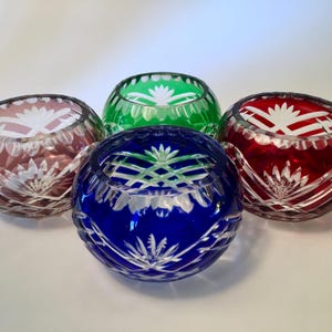 PRICE INCLUDES ALL 4! Gorgeous set of four crystal votive tealight candle holders in assorted colors with cut glass design