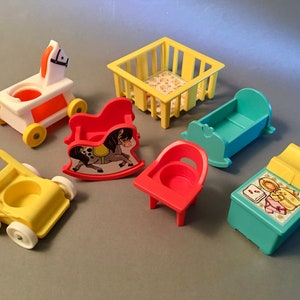 May include: A collection of vintage Fisher-Price toy furniture in various colors. Includes a yellow stroller, a white and orange rocking horse on wheels, a red rocking horse, a yellow crib, a blue cradle, a red chair, and a teal changing table.