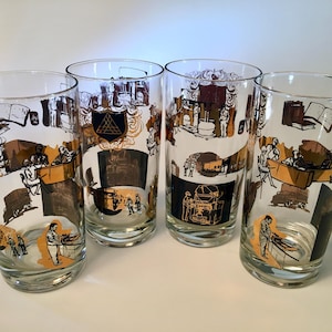 May include: Set of four vintage highball glasses. Each glass features a clear body with a decorative design in brown, black, and gold. The design includes illustrations of people, buildings, and machinery. The glasses are ideal for serving cold beverages.