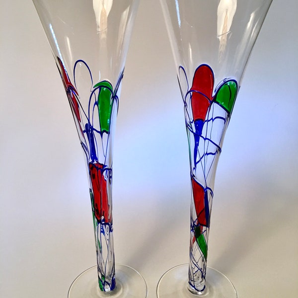 Stunning pair of tall mouth blown champagne flutes with blue swirl lines and stained panels of color - price includes both