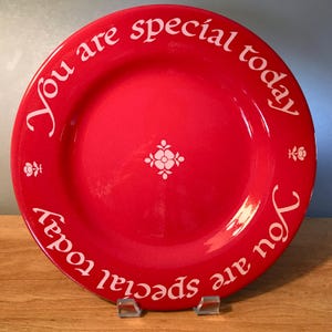 May include: A handmade wooden sign with the text "Welcome" in a playful font. The sign features a distressed white background and a dark brown border, perfect for a front door or entryway. The sign measures approximately 12 inches wide and 6 inches tall.