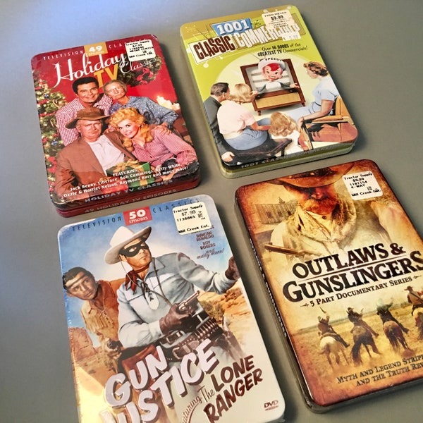 DVD collections in tins - Holiday TV Classics, 1001 Classic Commercials, Gun Justice Episodes, Outlaws & Gunslingers - sealed, never used