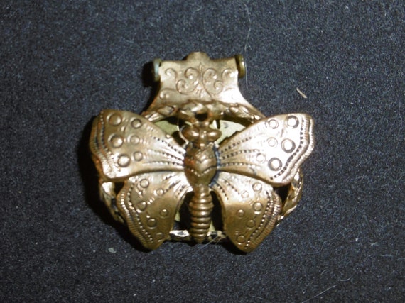 Cute shiny gold colured vintage French butterfly dress clip.