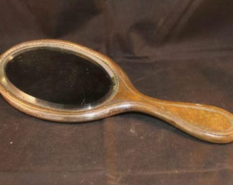 Antique French plated brass hand mirror. Heavy quality piece. Time worn charm.