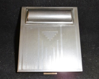 Super sleek and stlyish French Art Deco compact. Powder, rouge, lipstick.