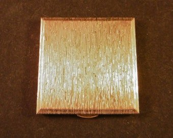 Rare, Caprice by Kigu, powder compact. Heavy gold tone textured effect.