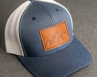 Mountain Range Hat | Leather Patch Trucker Style Hats for Men and Women | Hiking Outdoor Apparel | Adjustable Snapback | Gift Ideas