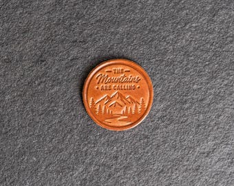 Mountains Calling Stamp Leather Magnet