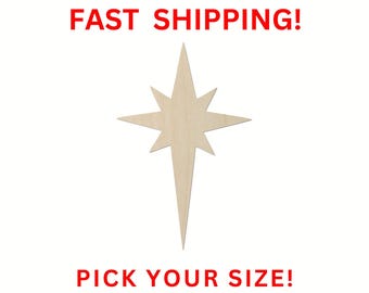 May include: A light-colored, flat, wooden star cutout with eight points, featuring a long bottom tail. The text FAST SHIPPING! is printed in red at the top, and the text PICK YOUR SIZE! is printed in red at the bottom of the image.