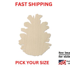 May include: A light-colored, unfinished wooden cutout shaped like a pinecone. The text on the image reads: FAST SHIPPING, PICK YOUR SIZE, See images for sizing!, Made in USA, and includes a small graphic of the American flag.