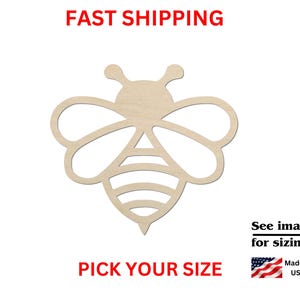 May include: A light-colored wooden cutout in the shape of a bee with stylized wings and a striped abdomen. The image includes the text FAST SHIPPING, PICK YOUR SIZE, See images for sizing!, and Made in USA with a small American flag icon.