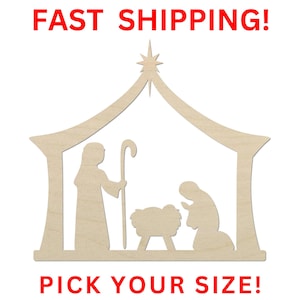 May include: A light-colored wooden cutout of a nativity scene featuring a stable structure with a star at the peak, a standing figure holding a staff, a central manger, and a kneeling figure. The text FAST SHIPPING and PICK YOUR SIZE is present.