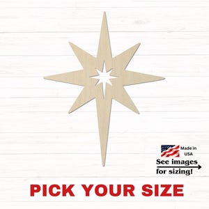 May include: A light-colored wooden star cutout with eight points of varying lengths and a small star-shaped negative space in the center. The text below reads PICK YOUR SIZE, and a small graphic includes the text Made in USA See images for sizing!