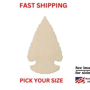 May include: A wooden arrowhead cutout in a natural wood tone. The arrowhead has a triangular shape with a notched base. Text at the top reads "FAST SHIPPING" and at the bottom "PICK YOUR SIZE". The image also includes the text "See images for sizing!" and "Made in USA".