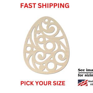 May include: A light-colored wooden egg-shaped cutout featuring an intricate laser-cut design of swirling lines and circular shapes. The cutout includes a small hole at the top for hanging. The text reads FAST SHIPPING, PICK YOUR SIZE, See images for sizing!, and Made in USA.