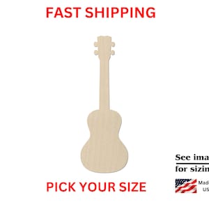 May include: Wooden cutout of an acoustic guitar, available in various sizes.  Pick your size. See images for sizing. Made in the USA.
