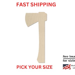 May include: A light-colored wooden cutout in the shape of an axe. The text on the image reads FAST SHIPPING, PICK YOUR SIZE, See images for sizing!, and Made in USA, accompanied by a small American flag icon. The axe shape has a flat handle.