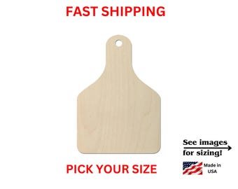 May include: A light-colored, unfinished wooden tag with a rounded top and a circular hole for hanging. The tag has a flat, rectangular base with rounded corners. The text on the image includes FAST SHIPPING, PICK YOUR SIZE, See images for sizing!, and Made in USA.