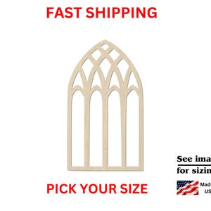 May include: A light-colored, unfinished wooden cutout in the shape of a gothic cathedral window with a pointed arch and intersecting tracery patterns. The design features four vertical columns topped by a decorative lattice of curved arches.