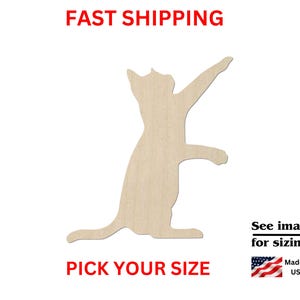 May include: A light-colored, flat wooden cutout in the shape of a cat standing on its hind legs with one front paw raised. The image includes the text FAST SHIPPING, PICK YOUR SIZE, See images for sizing!, and Made in USA with a small flag icon.
