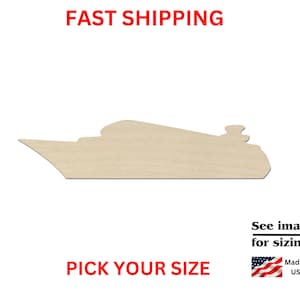 May include: A flat, light-colored wooden cutout in the shape of a cruise ship. The silhouette features a pointed bow, a tiered upper deck structure, and a small chimney stack at the stern. The surface is smooth and unfinished, showing natural wood grain.