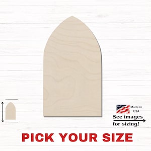 May include: A light-colored wooden cutout in the shape of a pointed arch with a flat base. The surface displays a natural wood grain pattern. A small icon with a double-ended arrow indicates height, and text reads Made in USA, See images for sizing!, PICK YOUR SIZE.