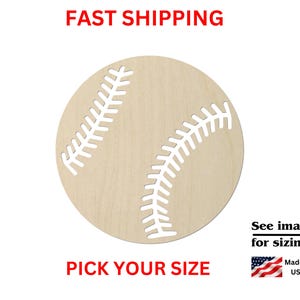 May include: A circular light-colored wooden cutout featuring a laser-cut baseball stitch pattern. The design includes two curved lines of stitches across the center of the round wooden surface, creating a clear representation of a baseball.