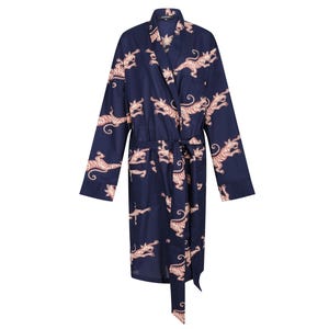 May include: A navy blue robe with a repeating pattern of orange tigers. The robe has long sleeves, a wrap-around design, and a matching belt. The robe is made of a soft, flowing fabric.