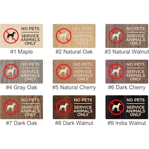 May include: Nine different wood samples with a "No Pets, Service Animals Only" sign printed on each. The signs feature a red circle with a diagonal line through it and a silhouette of a dog. The wood samples are labeled with numbers 1 through 9 and the wood type.