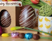 Chocolate Easter egg: 12 cm 340g handmade chocolate Easter egg filled with small chocolate eggs. Fully sustainable plastic free Easter Egg