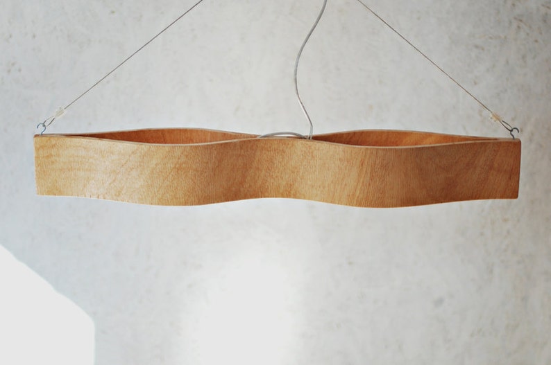 hanging lamp made from bent plywood. The Eyes
