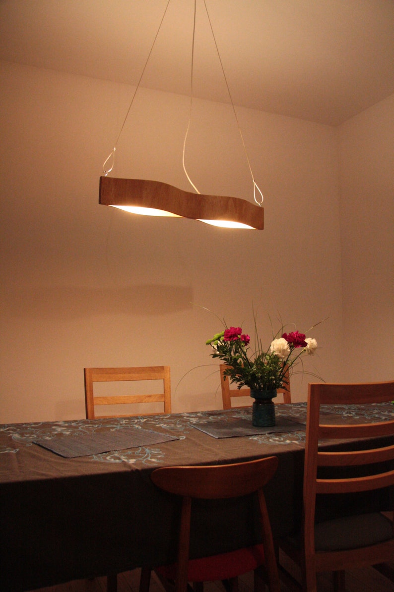 hanging lamp made from bent plywood. The Eyes