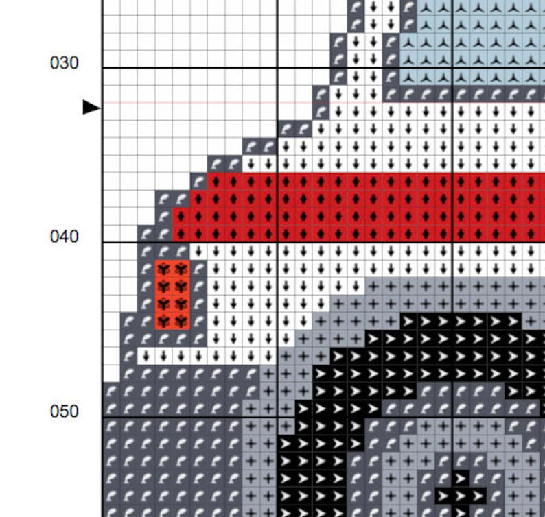 May include: Cross stitch pattern with a black and white design of a dog's head with a red and white stripe across the forehead. The pattern is on a white grid.