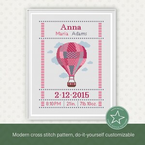Op de afbeelding: Een kruissteekpatroon met een roze en witte luchtballon met de tekst "Anna Maria Adams" en "2-12-2015 8:10 PM | 21in. 7lb. 10oz."