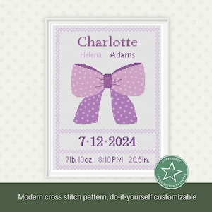 May include: A cross stitch pattern featuring a purple bow with white polka dots. The pattern includes the name Charlotte, Helena Adams, the date 7-12-2024, and the birth details 7lb. 10oz., 8:10PM, 20.5in.