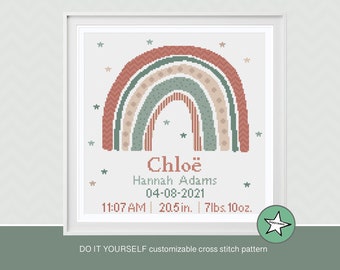 May include: A cross stitch pattern featuring a rainbow with a chevron, polka dot, and striped design. The rainbow is in shades of green, pink, and beige. The pattern also includes the name "Chloë", the date "04-08-2021", and the time "11:07 AM". The pattern also includes the baby's weight and length: "7lbs. 10oz." and "20.5 in."
