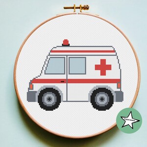 May include: A white ambulance with a red cross on the side and a red light on top. The ambulance is on a white background.
