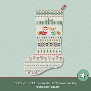 May include: A white Christmas stocking with a green, red, and white cross stitch pattern. The stocking features two corgis wearing red and green sweaters, a Christmas tree, and the name "Elza".