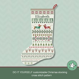 May include: Customizable Christmas stocking with a cross-stitch pattern. The design features a festive pattern with reindeer, snowflakes, and Christmas trees. The name "Elizabeth" is displayed at the top, and two dachshunds wearing sweaters and Santa hats are in the middle.