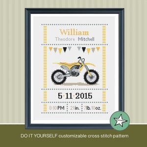 May include: A cross stitch pattern featuring a yellow dirt bike with a gray and black color scheme. The pattern includes the name "William Theodore Mitchell", the date "5-11-2015", and the time "8:10 PM". The pattern also includes the baby's measurements: "21 in. 7lb. 10oz."