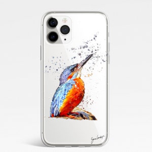 May include: Clear iPhone case featuring a watercolor painting of a kingfisher bird. The bird has blue, orange, and white feathers, with a long beak. The case has a glossy finish and a signature in the bottom right corner.
