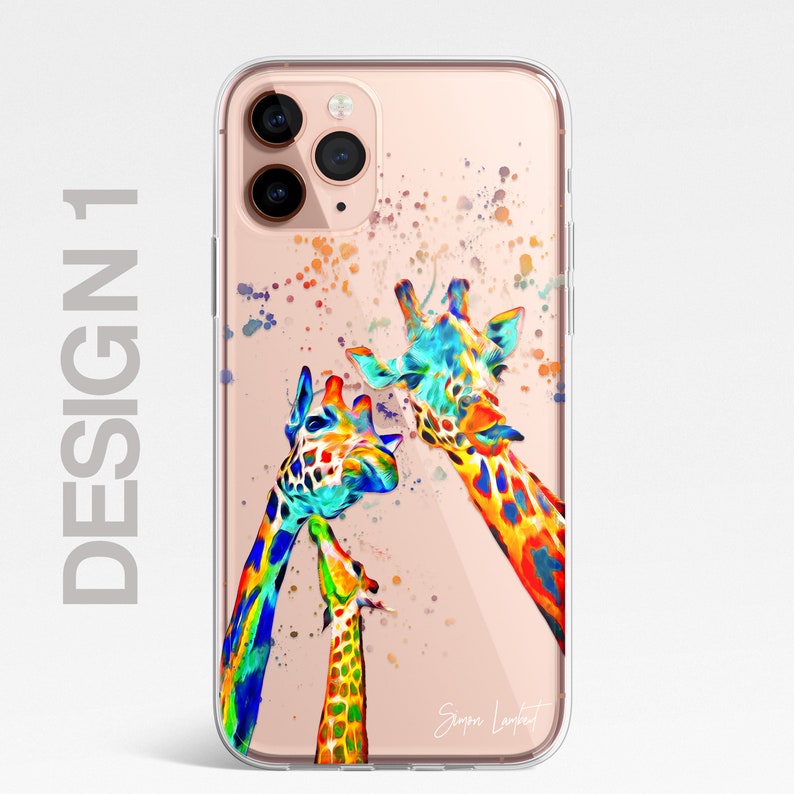 May include: A clear phone case with a colorful watercolor design of three giraffes. The giraffes are painted in shades of blue, green, yellow, orange, and red. The case has a gold background and the artist's signature is visible in the bottom right corner.