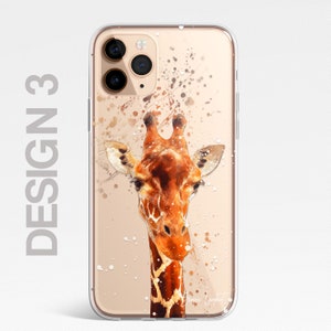 May include: A clear phone case with a watercolor-style illustration of a giraffe's head against a gold background with white splatters. The case has a cutout for the phone's camera.