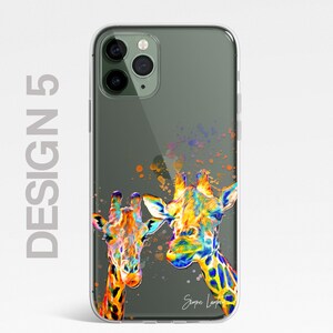 May include: A clear phone case with a colorful illustration of two giraffes. The giraffes are painted in a vibrant rainbow color scheme with splashes of paint in the background. The artist's signature, "Simon Lambert", is visible in the bottom right corner.