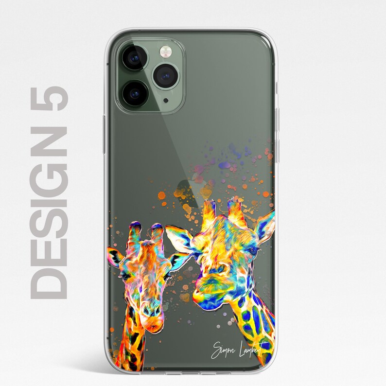 May include: A clear phone case with a colorful illustration of two giraffes. The giraffes are painted in a vibrant rainbow color scheme with splashes of paint in the background. The artist's signature, "Simon Lambert", is visible in the bottom right corner.