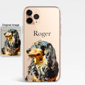 K&ouml;nnte beinhalten: Eine transparente Handyh&uuml;lle mit goldfarbenem Rand und einer Illustration eines schwarzen und braunen Dackels. Der Name des Hundes, "Roger", ist in schwarzer Schrift auf der H&uuml;lle aufgedruckt.