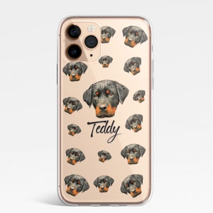 May include: A clear phone case with a pattern of Rottweiler dog faces. The case has a gold background and the name "Teddy" is written in black cursive.